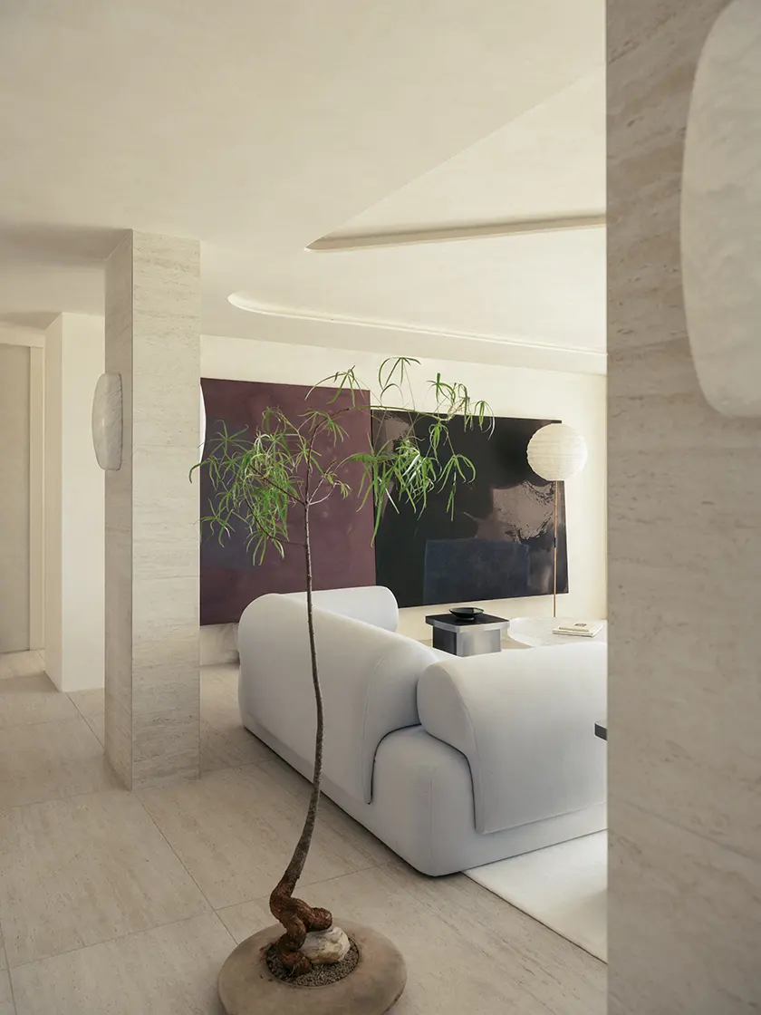 Nina_Maya_FAIRFAX-217 Living room viewed through architectural columns with upholstered seating, design by Nina Maya Interiors