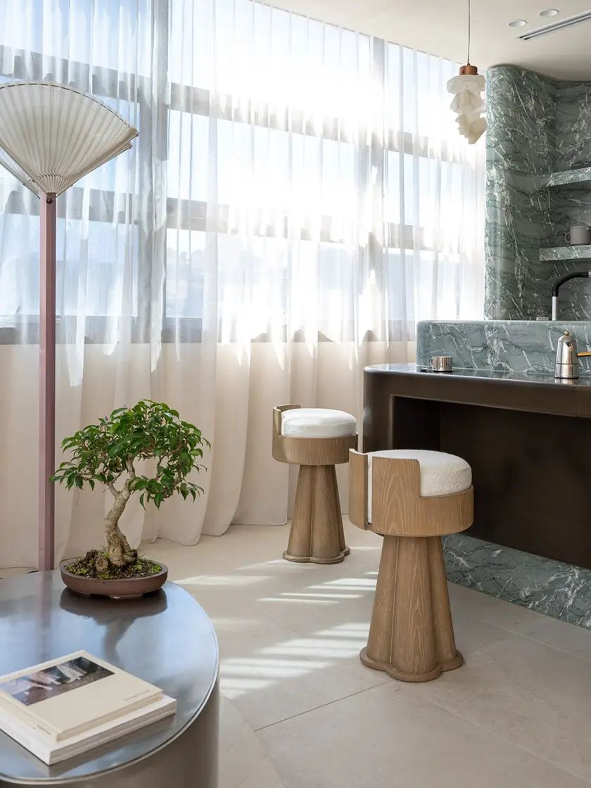 The_Woollahra_Clinic_by_Nina_Maya_Interiors_230 Custom timber bar stools in contemporary interior with curved marble bar and soft natural light